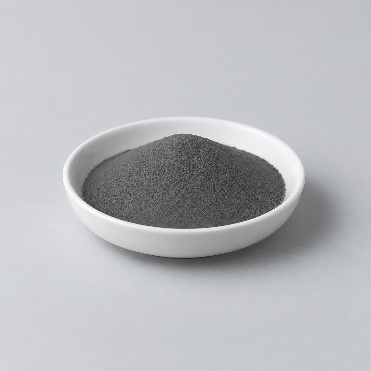 Representative image of 7075 Aluminum Alloy Spherical Powder: fine dark gray alloy powder in a white dish