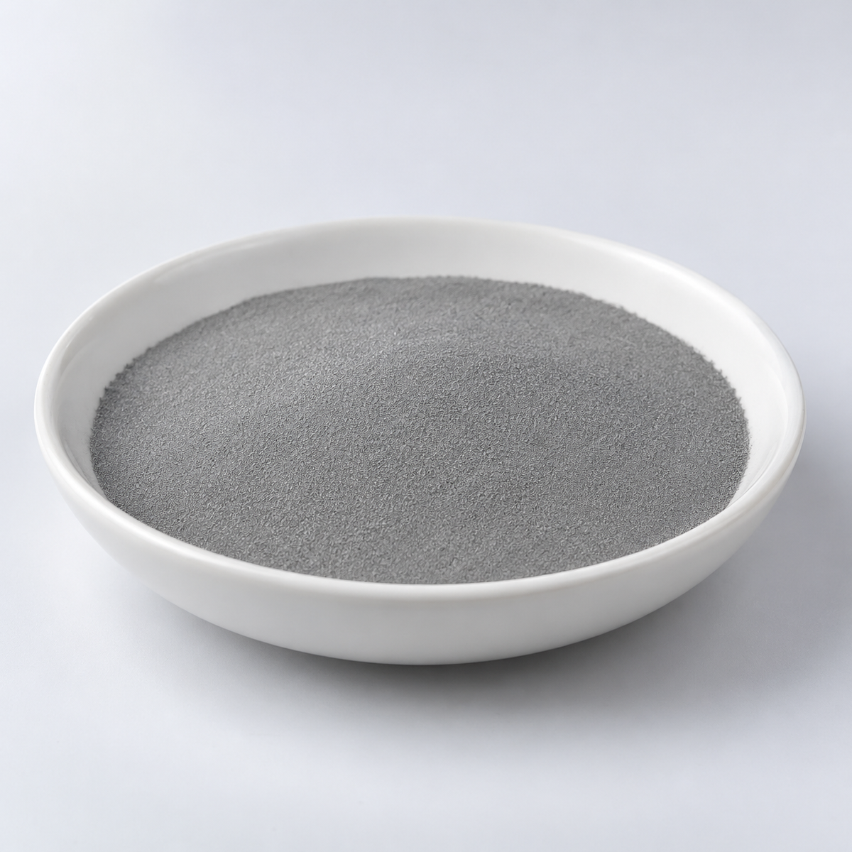 Representative image of AlSi9Cu3 Aluminum Alloy Spherical Powder: fine neutral gray AlSi9Cu3 aluminum-silicon-copper spherical alloy powder in a white dish