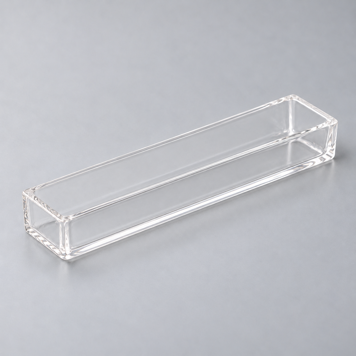 Representative image of Quartz Evaporation Boat: flat-bottom rectangular clear quartz boat with equal-height straight walls.
